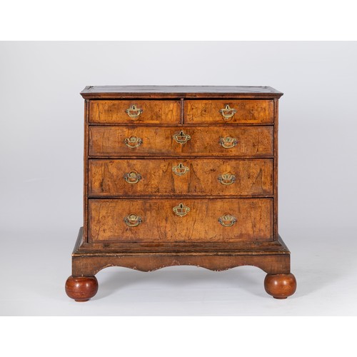 115 - A WALNUT AND CROSSBANDED CHEST-OF-DRAWERS, 18TH CENTURY