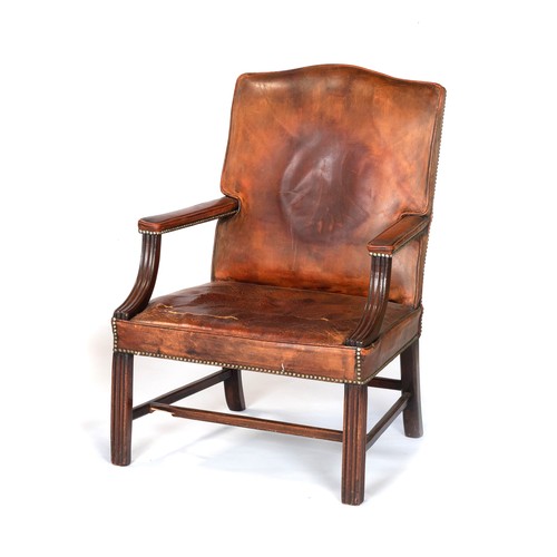 136 - A LEATHER ARMCHAIR