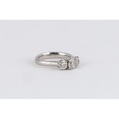 518 - A DIAMOND THREE-STONE RING, BROWNS