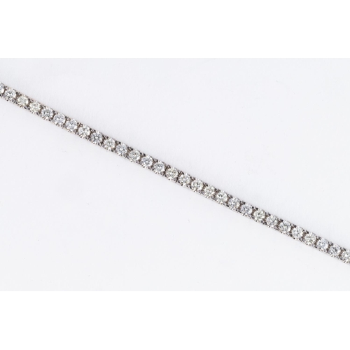 528 - A DIAMOND TENNIS BRACELET