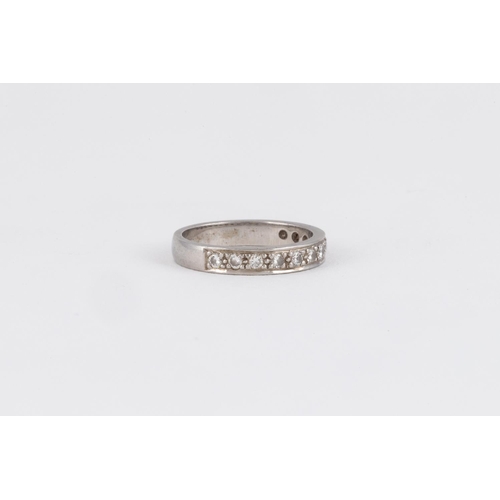 530 - A DIAMOND HALF-ETERNITY RING