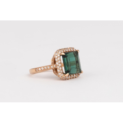 543 - A GREEN TOURMALINE AND DIAMOND RING