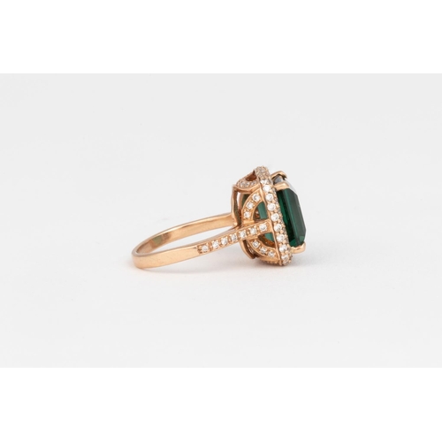 543 - A GREEN TOURMALINE AND DIAMOND RING