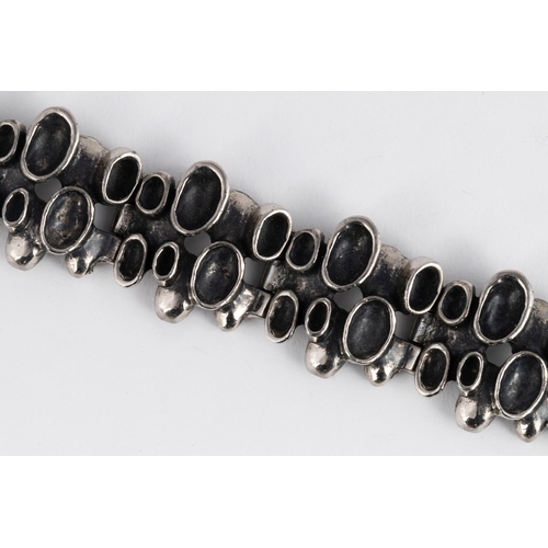 579 - A PEWTER BRACELET, ROBERT LARIN