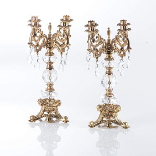 147 - A PAIR OF GILT METAL AND CRYSTAL CANDELABRA