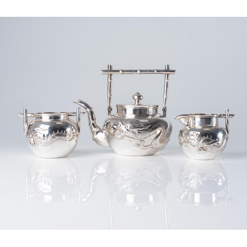 488 - A CHINESE SILVER THREE-PIECE TEA SET