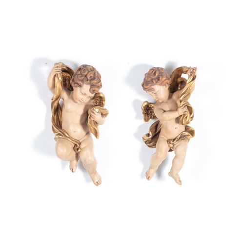 152 - A PAIR OF ITALIAN CARVED AND PAINTED PUTTI