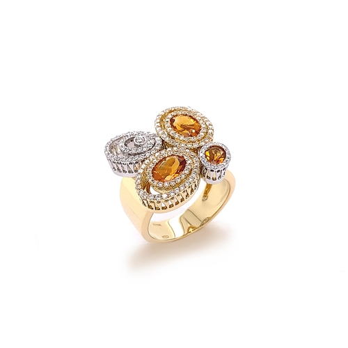 213 - CIRCULAR DESIGN FANCY CITRINE AND DIAMOND RING