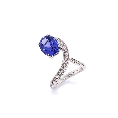 230 - TWIST DESIGN TANZANITE AND DIAMOND RING