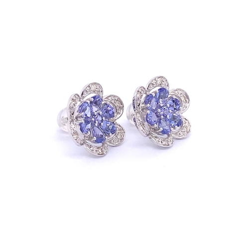 251 - PAIR OF FLOWER DESIGN TANZANITE & DIAMOND STUD EARRINGS