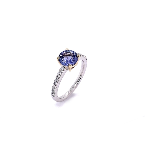 87 - SOLITAIRE TANZANITE RING WITH MICRO SET DIAMONDS ON THE BAND