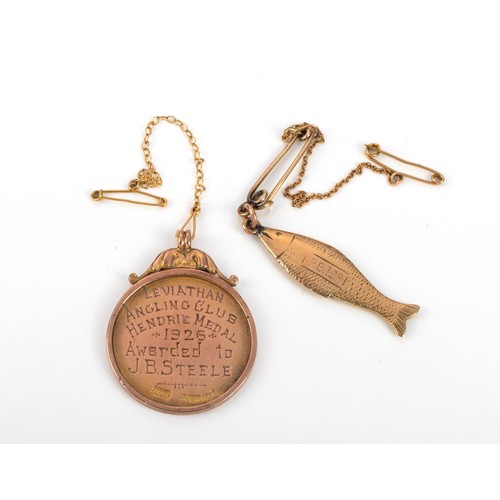 582 - TWO 9CT GOLD COMMEMORATIVE FISHING PENDANTS