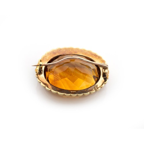 584 - A CITRINE AND SEED PEARL BROOCH