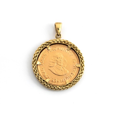 632 - A COIN-MOUNTED PENDANT