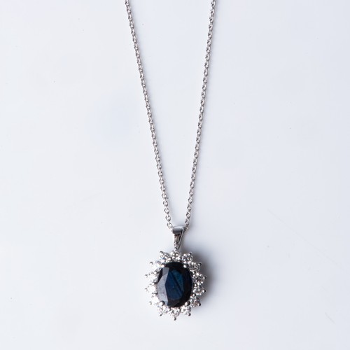 695 - A SAPPHIRE AND DIAMOND PENDANT