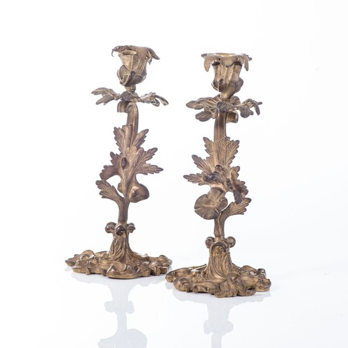 567 - A PAIR OF ROCOCO-STYLE GILT-METAL CANDLESTICKS