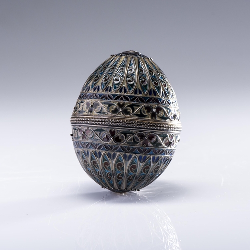 565 - A RUSSIAN METAMORPHIC SILVER-GILT AND PLIQUE-A-JOUR EGG, STAMPED 88, FABERGE WORKMASTER MIKHAIL EVLA... 