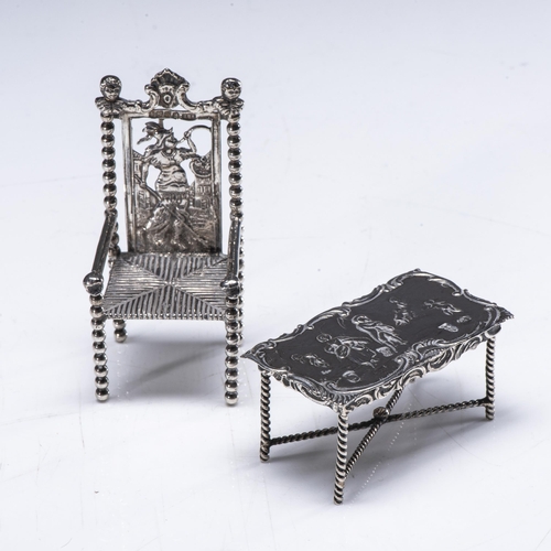 751 - A DUTCH MINIATURE SILVER ARMCHAIR AND RECTANGULAR TABLE67grams