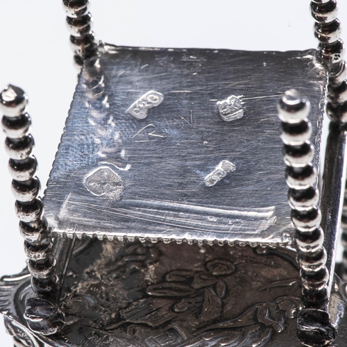 751 - A DUTCH MINIATURE SILVER ARMCHAIR AND RECTANGULAR TABLE67grams