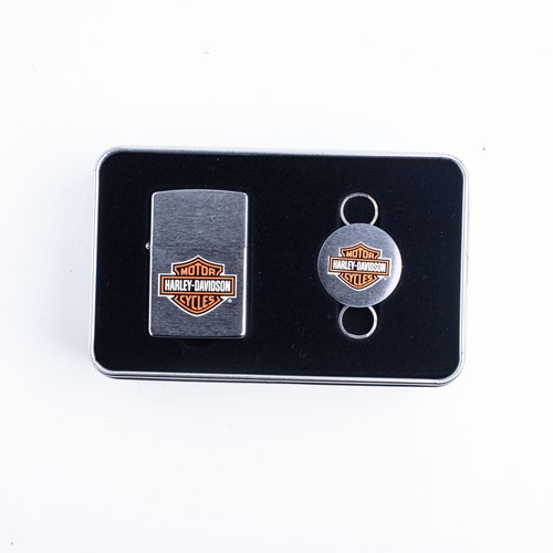 109 - FOUR CASED HARLEY DAVIDSON ZIPPO LIGHTERS AND KEYRINGS