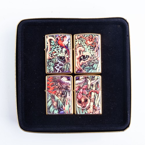 129 - A SET OF FOUR CASED MYSTERY OF THE FORREST ZIPPO LIGHTERS