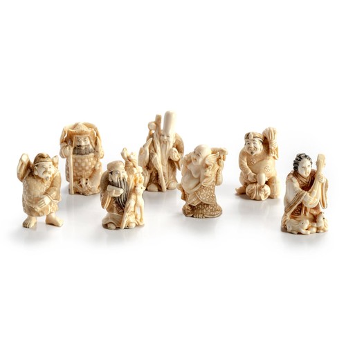 608 - A GROUP OF MINIATURE JAPANESE IVORY 'SEVEN LUCKY GODS' OKIMONO, MEIJI PERIOD, 1868 - 1912