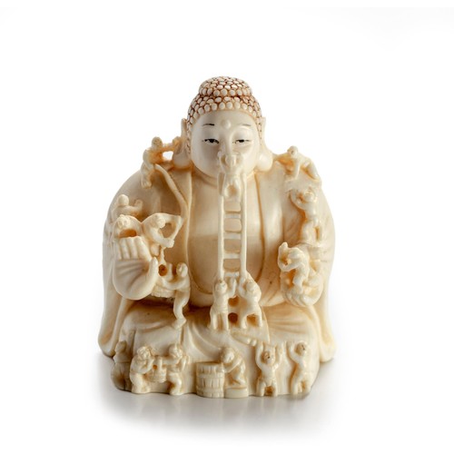 607 - A JAPANESE IVORY NETSUKE OF A BUDDHIST SCULPTURE, TAISHO PERIOD, 1912 - 1926