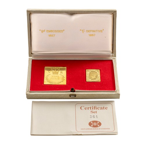 151 - A CASED SET OF TWO 18CT GOLD EARLY NATAL POSTAGE STAMP REPLICAS