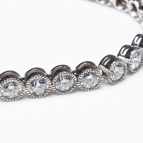 841 - A DIAMOND TENNIS BRACELET