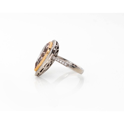 830 - A MORGANITE AND DIAMOND RING