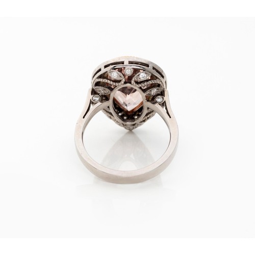 830 - A MORGANITE AND DIAMOND RING