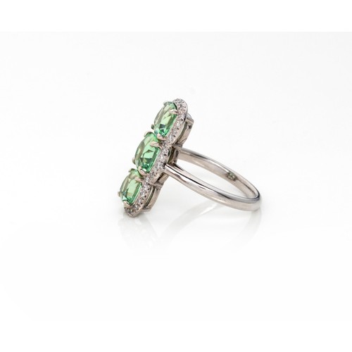 831 - A TOURMALINE AND DIAMOND RING