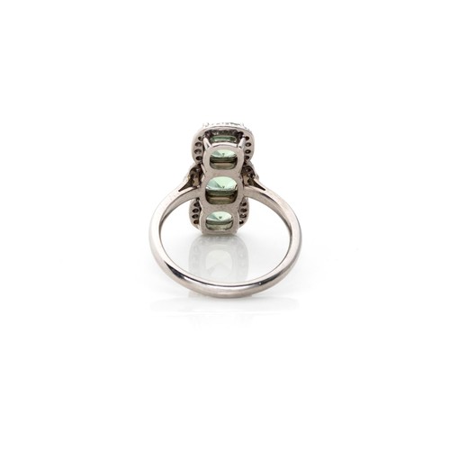 831 - A TOURMALINE AND DIAMOND RING