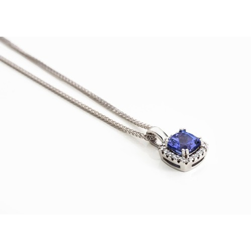 924 - A TANZANITE AND DIAMOND PENDANT