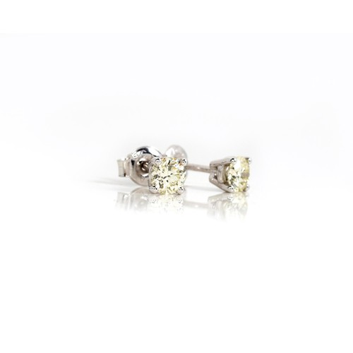 925 - A PAIR OF DIAMOND EAR STUDS