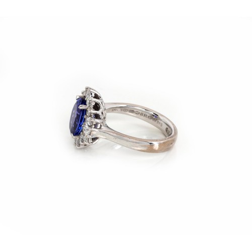 928 - A TANZANITE AND DIAMOND RING, BROWNS