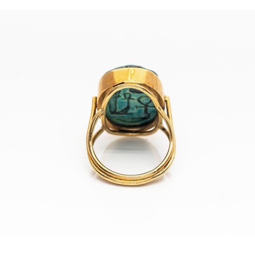 936 - A GOLD RING MOUNTED WITH A 'SCARAB'