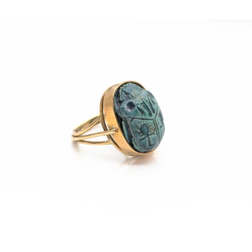 936 - A GOLD RING MOUNTED WITH A 'SCARAB'