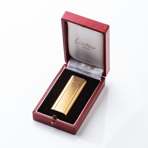 A GOLD PLATED CARTIER LIGHTERAccompanied by original box and