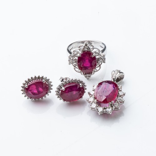 839 - A SUITE OF RUBY AND DIAMOND JEWELLERYComprising: a ring, a pair of earrings and a pendant, set with ... 