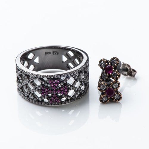 842 - A RUBYLITE RING WITH MATCHING EARRINGSThe ring pavé-set with created rubies in a cross formation, wi... 