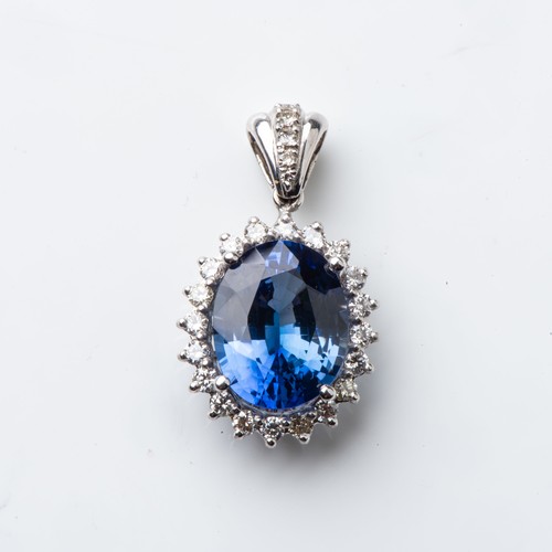 846 - A SAPPHIRE AND DIAMOND PENDANT Claw-set to the center with an oval certified sapphire weighing 7,37 ... 