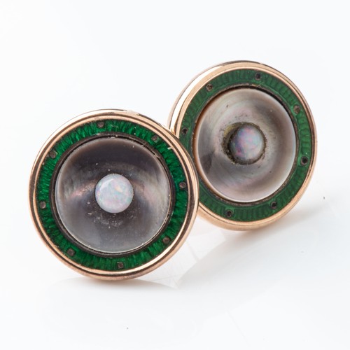 851 - A PAIR OF EARRINGSGreen enamel and opal center in 9ct rose gold, circa 1930... 