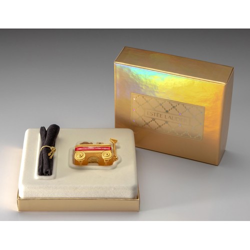 163 - AN ESTEE LAUDER SOLID PERFUME COMPACT, TOY WAGON, 1999