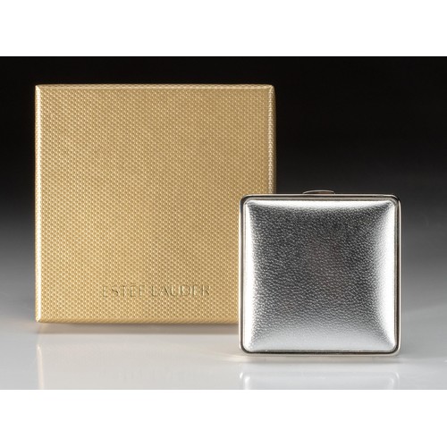 99 - AN ESTEE LAUDER POWDER COMPACT, TIMELESS TOUCH LUCIDITY COMPACT