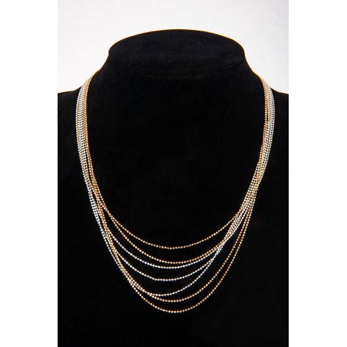 66 - A GOLD MULTI-STRAND NECKLACE