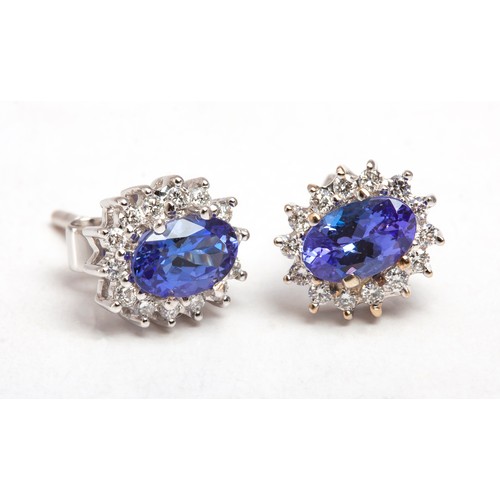 113 - A PAIR OF TANZANITE AND DIAMOND EARRINGS