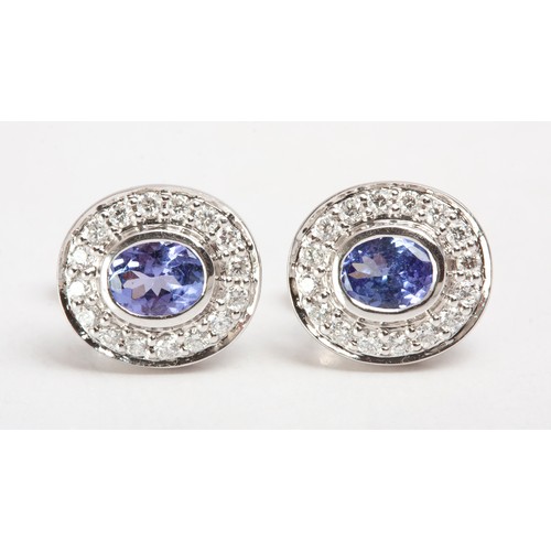 115 - A PAIR OF TANZANITE AND DIAMOND EARRINGS