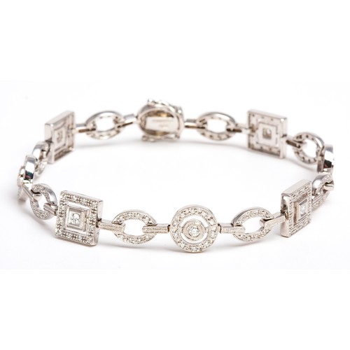 406 - A DIAMOND TENNIS BRACELET, BROWNS