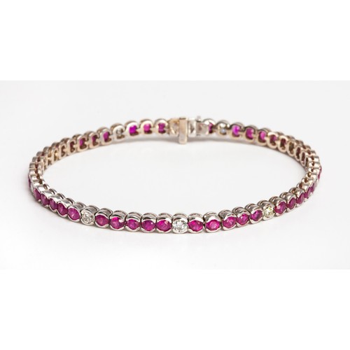 386 - A DIAMOND AND RUBY TENNIS BRACELET